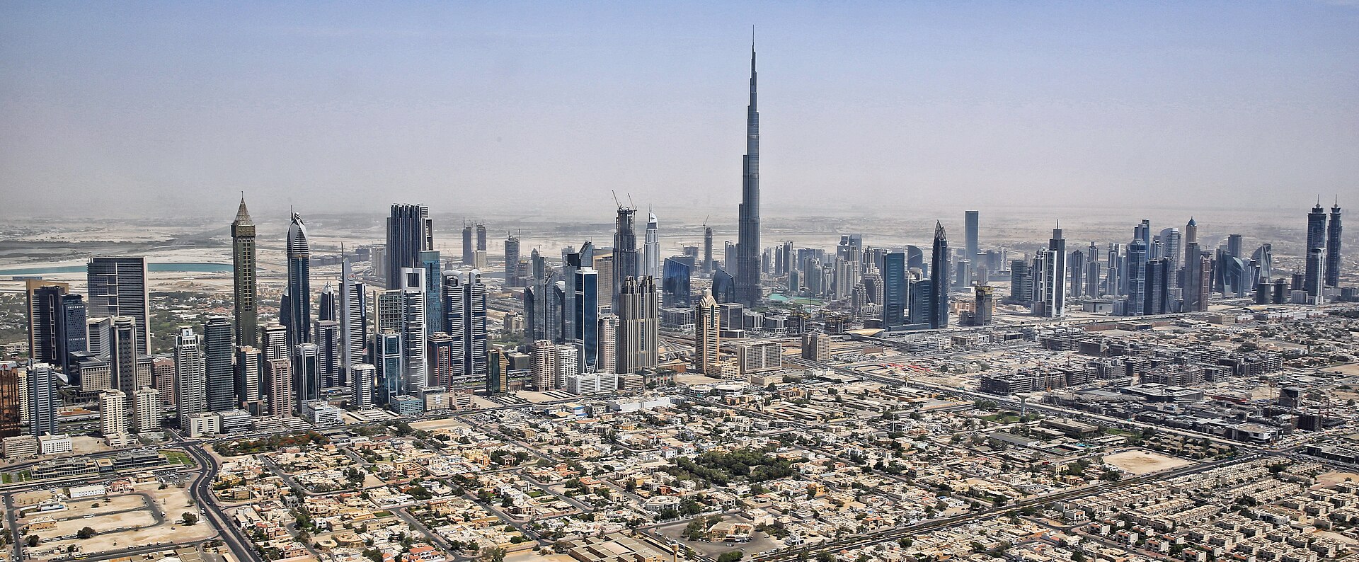 The Dubai skyline at dusk, dominated by the Burj Khalifa