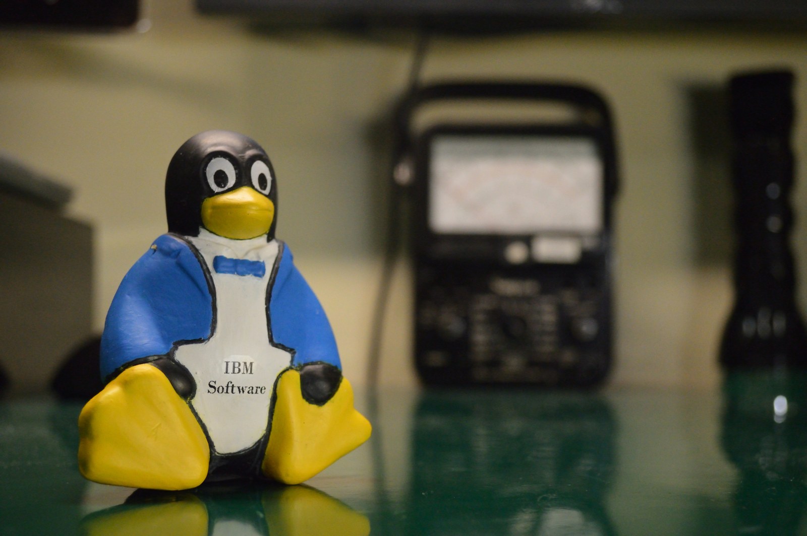 A large Tux penguin figure — the Linux mascot — photographed indoors