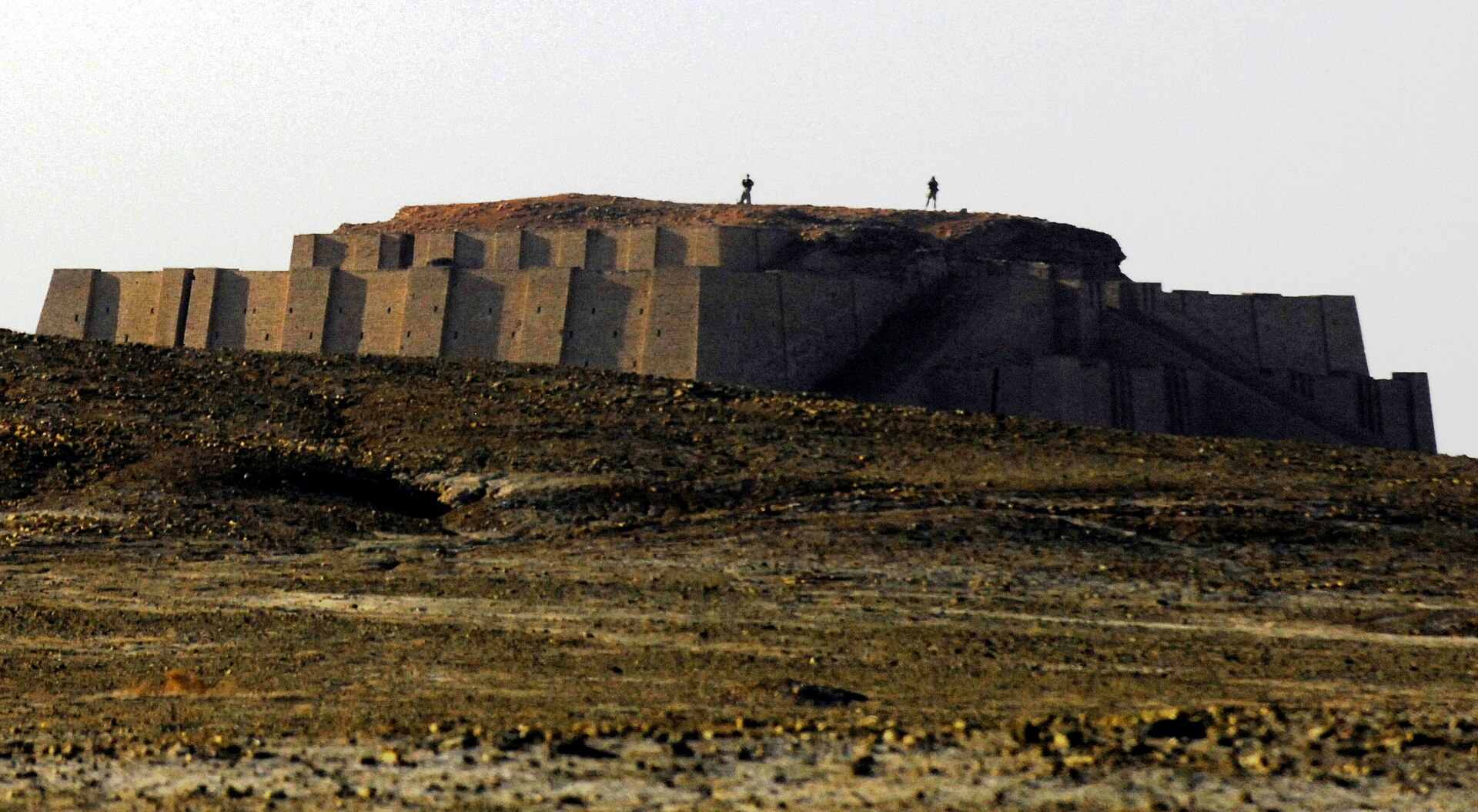The Great Ziggurat of Ur rising from the desert plain — the stepped mud-brick temple tower begun under King Ur-Nammu