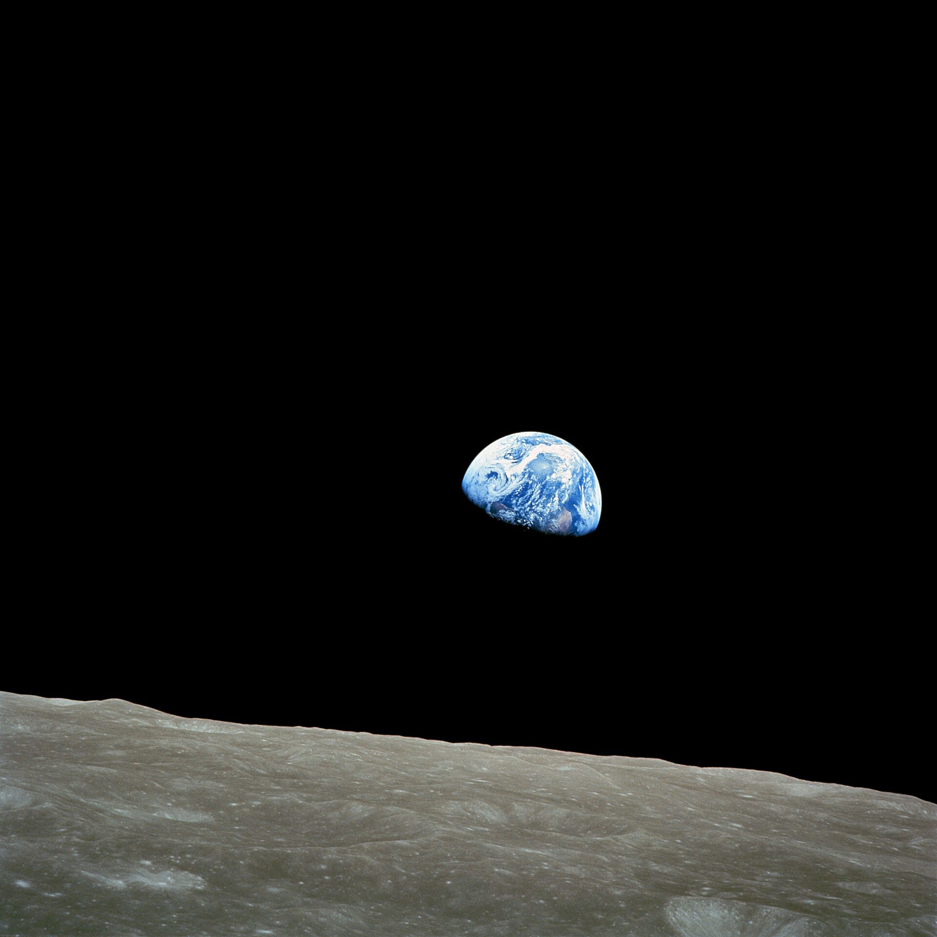 Earthrise over the lunar surface, photographed from Apollo 8