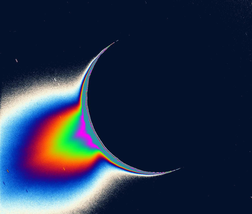 Backlit plume of ice and vapor rising from the south polar 'tiger stripes' of Enceladus, seen by Cassini in a greatly enhanced and colorized view