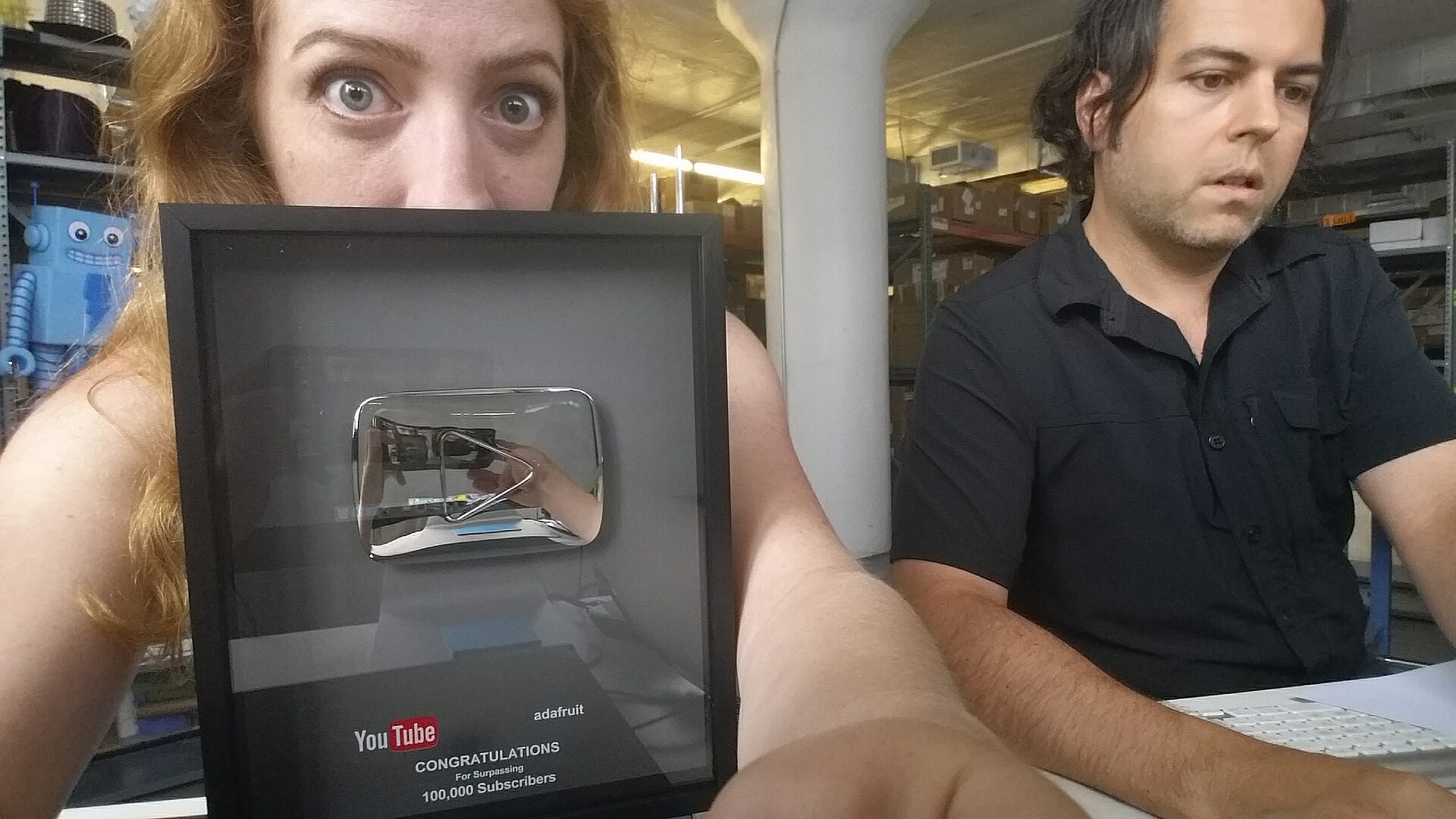 A Silver Creator Award (Silver Play Button) presented by YouTube to channels that reach 100,000 subscribers